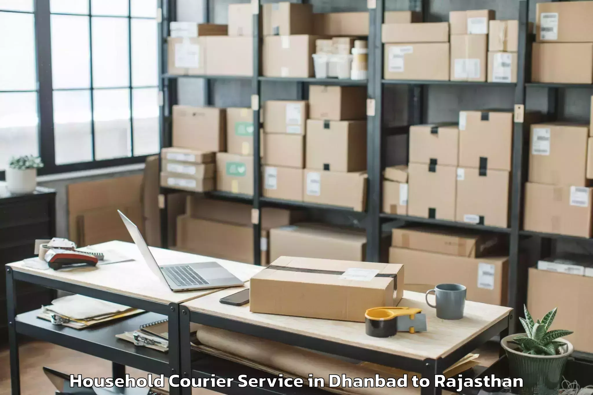 Dhanbad to Beejoliya Household Courier Booking